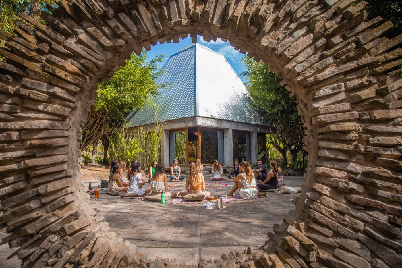 Outdoor yoga warrior pose at Kantu Garden Lodge — Moksha Yoga Amazónica retreat in the Peruvian Amazon